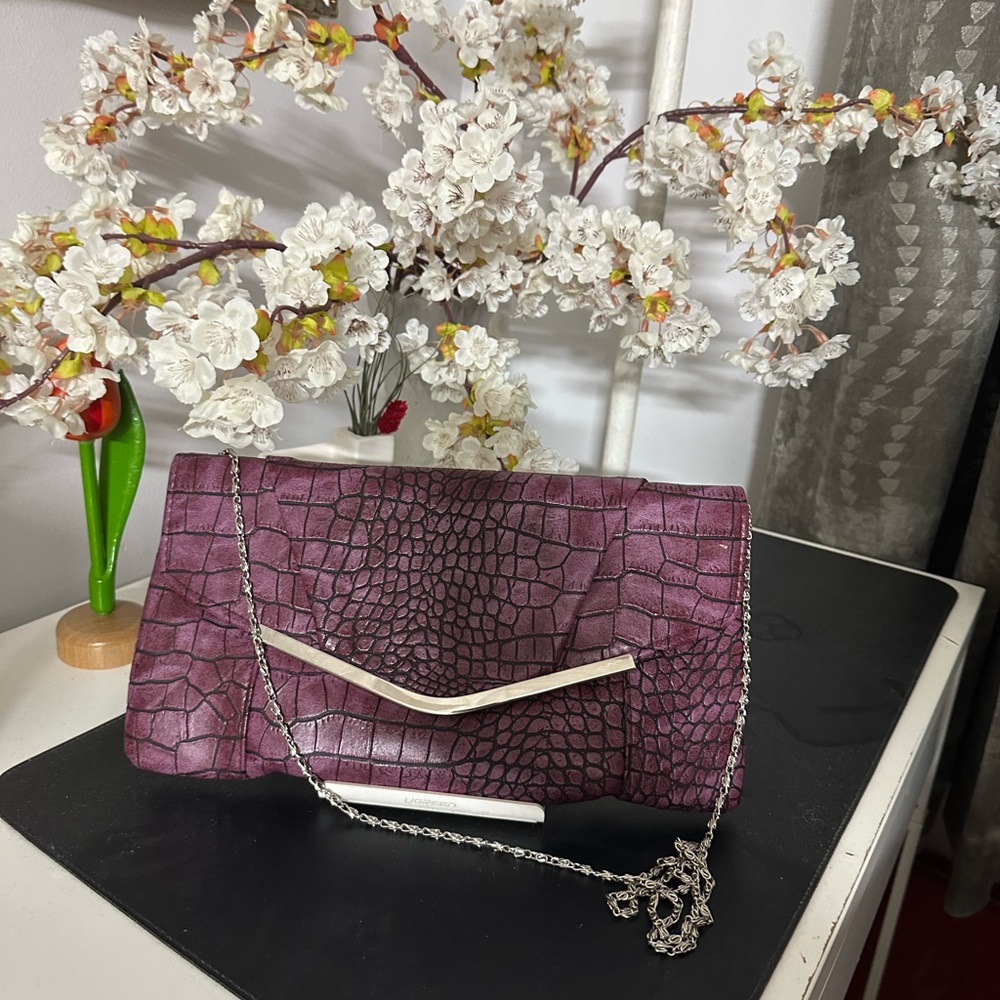 Dark pink clutch.